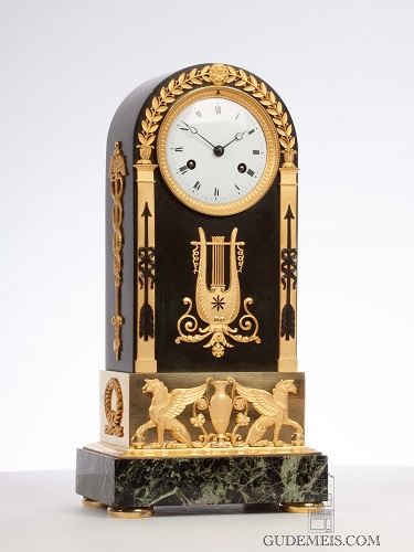 A fine French Empire arched ormolu and bronze mantel clock, circa 1800.